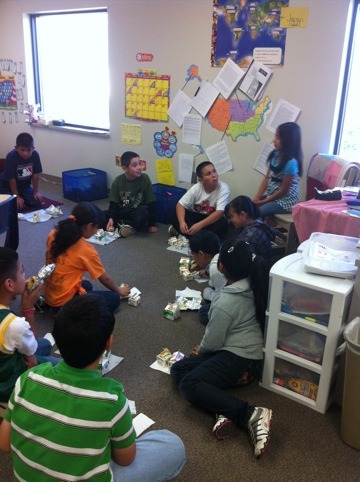 Students sitting on the floor with lunches