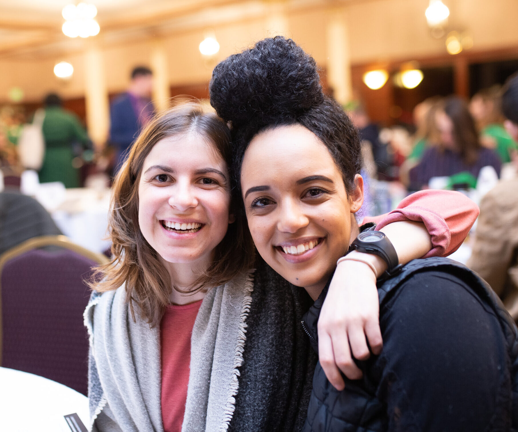 two women hugging and smiling at legislative action day (become an advocate)