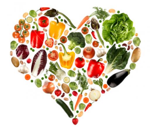 assorted vegetables arranges into the shape of a heart